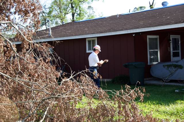 Inspector completing a final review of a temporary roof repair