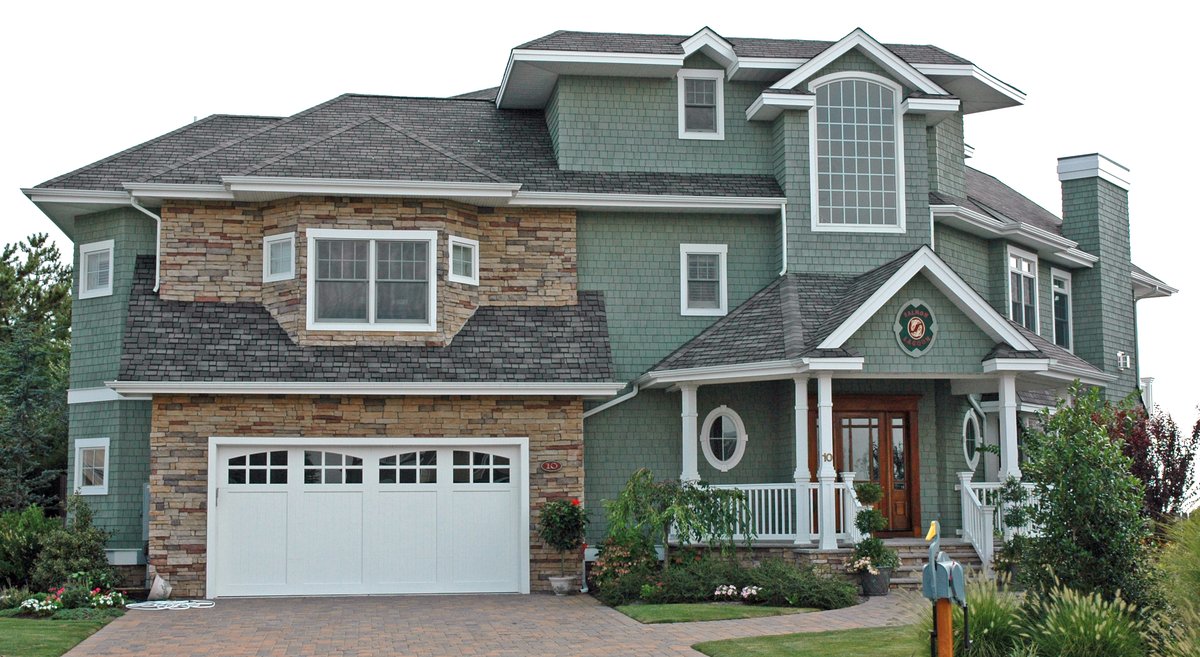 Two-story residential home with an ordinary asphalt shingle roof